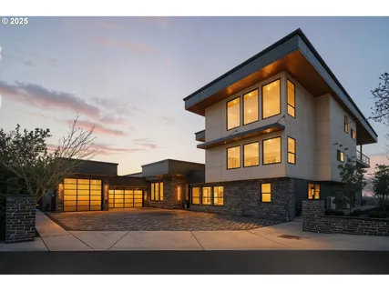 a view front of houses with a yard