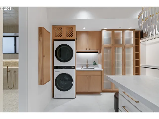 a kitchen with a refrigerator a sink and cabinets
