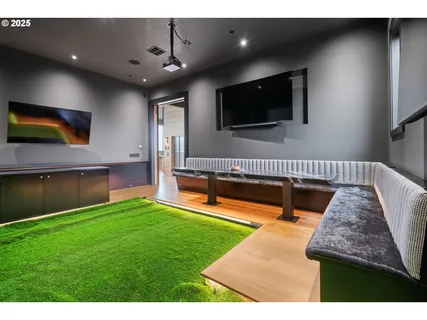 a living room with patio furniture and a fireplace