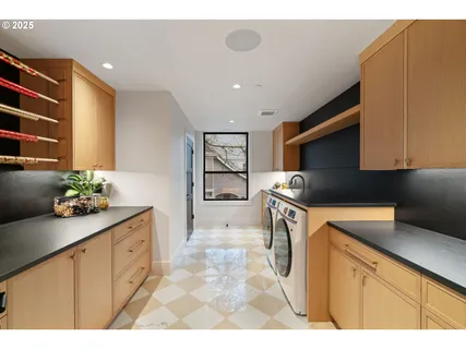 a kitchen with granite countertop a sink and cabinets