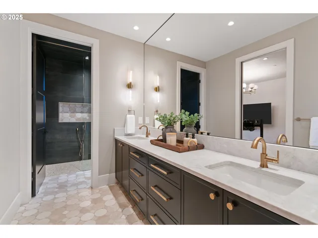 a living room with furniture a flat screen tv and kitchen view