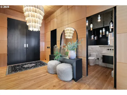 a bedroom with a bed and a chandelier