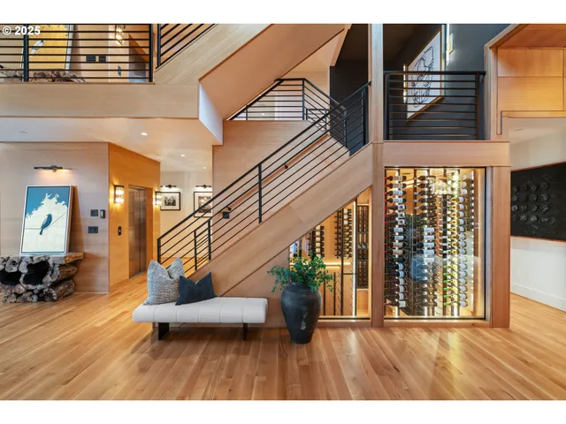 a view of an entryway with wooden floor