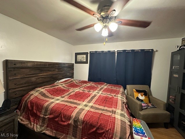 1913 Coltman Road Cleveland, OH 44106 - Photo 9 of 32 Bedroom 1 downstairs featuring ceiling fan and wood finished floors