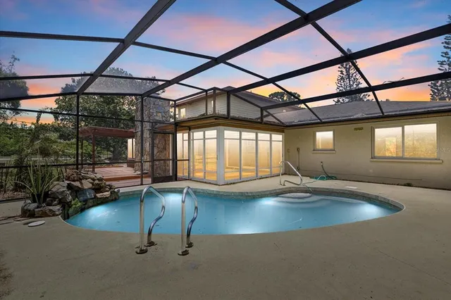 a indoor swimming pool with view of outdoor space