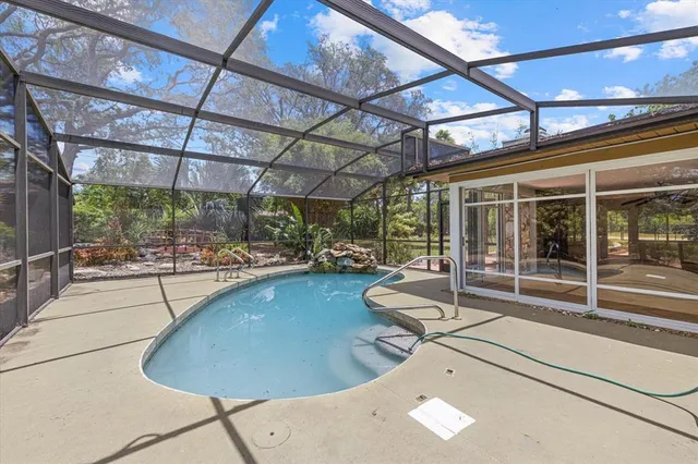 a view of a swimming pool with a patio