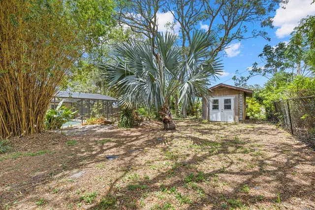 a backyard of a house with lots of green space