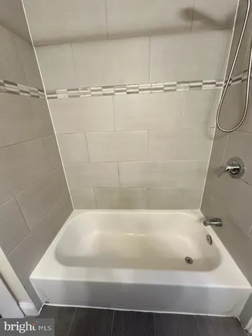 a close view of a bathtub in bathroom