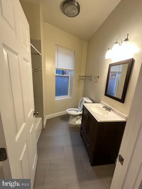2740 St Paul Street, Unit 3 Baltimore, MD 21218 - Photo 6 of 6 a bathroom with a sink a toilet and mirror