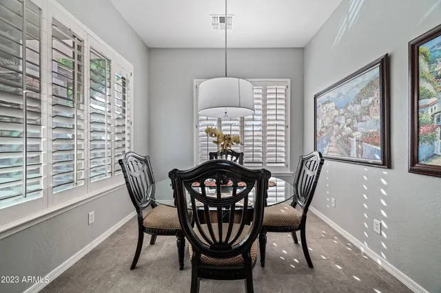a view of a dining room with furniture window and outside view