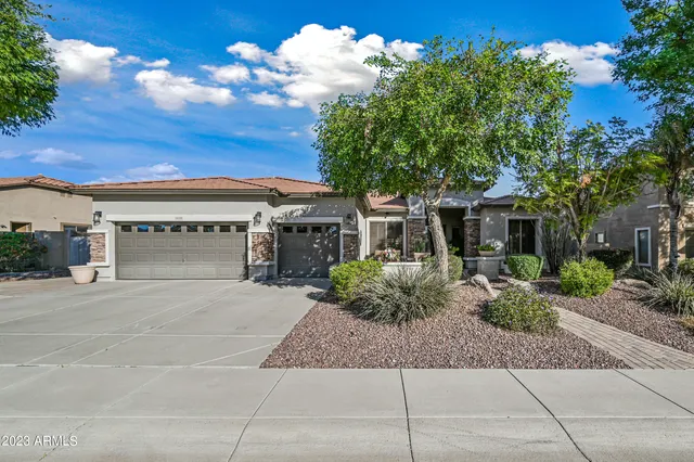 front view of a house with a garden