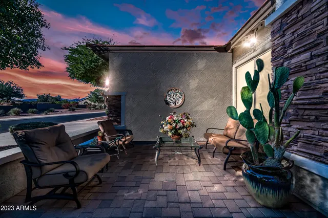 a view of a chairs and table in the patio