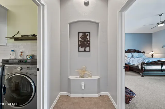 a en suite bathroom with a toilet a sink and mirror