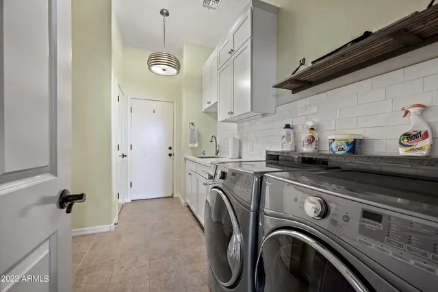 a utility room with dryer and washer