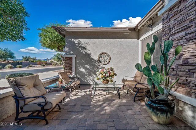 a view of a chairs and table in the patio