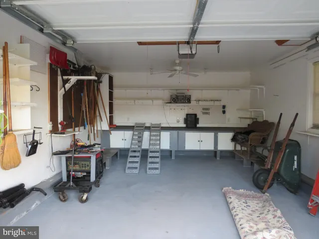 a room with gym equipment and a window