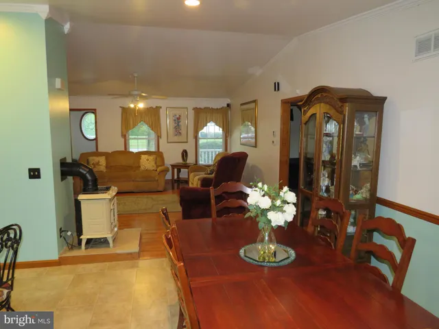 a living room with furniture and a lamp