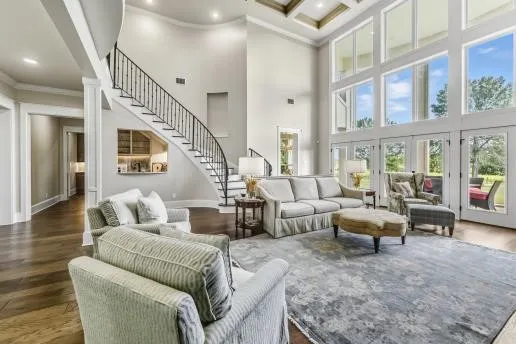 a living room with furniture or couch and a large window