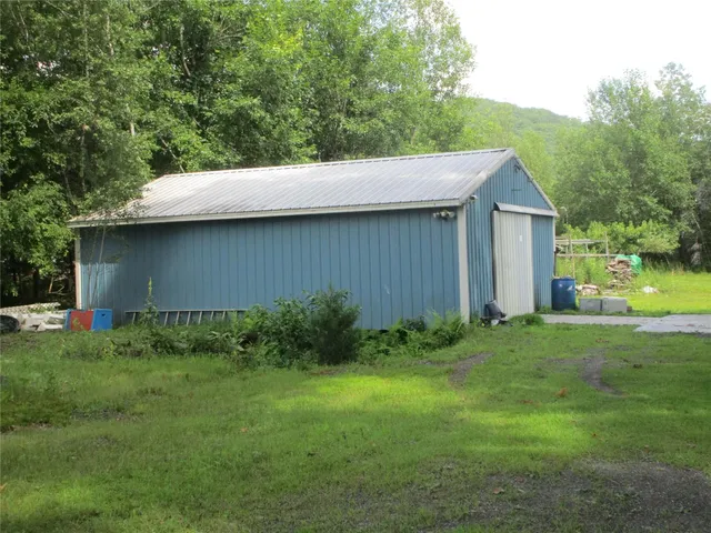 a view of a house with a big yard