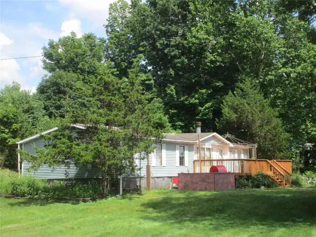 a view of an chairs and table in the patio