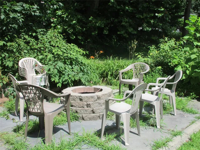 a view of outdoor space with playground and green space