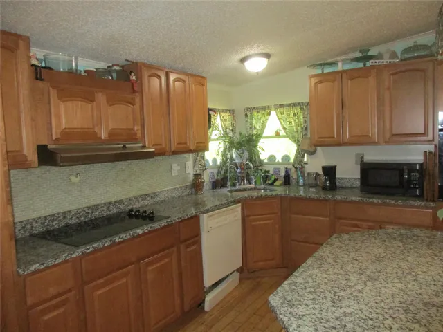 a kitchen with a table and chairs