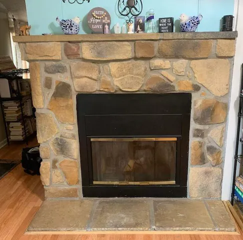a bathroom with a sink and a fireplace