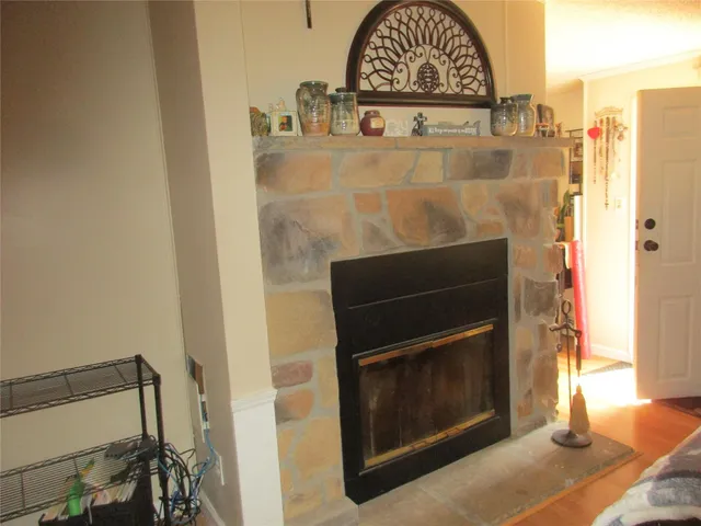 a living room with furniture a ceiling fan and a window