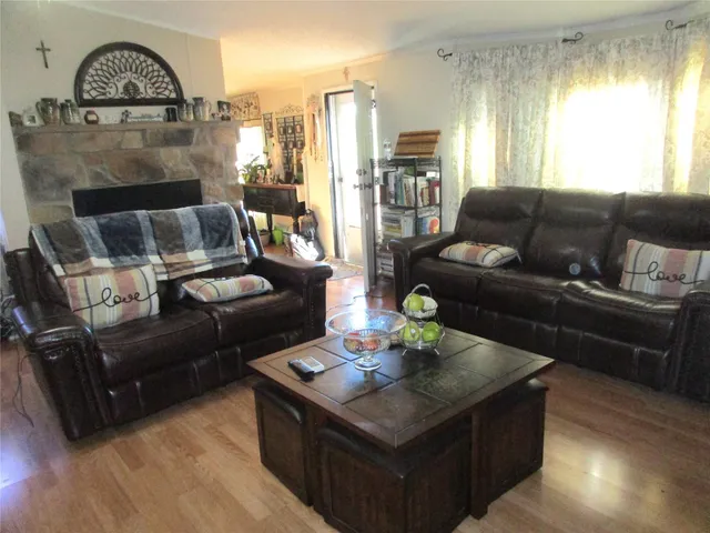 a bathroom with a granite countertop toilet sink and mirror