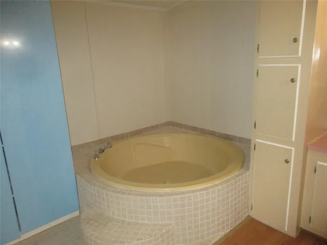 a white toilet sitting next to a bathroom sink