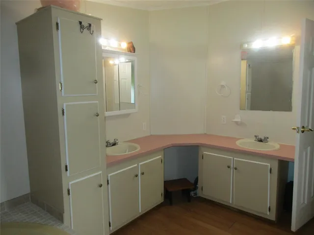 a front view of a house with yard and green space