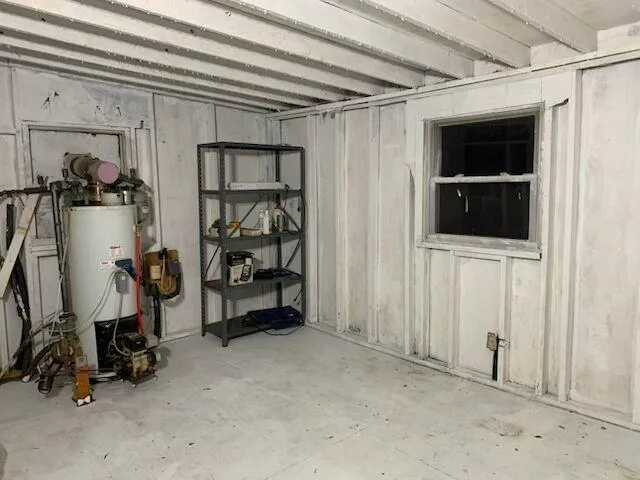 a view of a chairs and table in the backyard