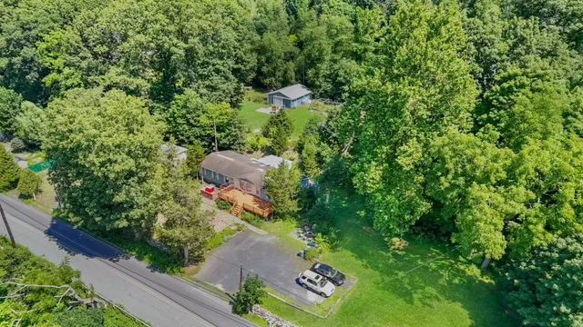 a backyard of a house with lots of green space