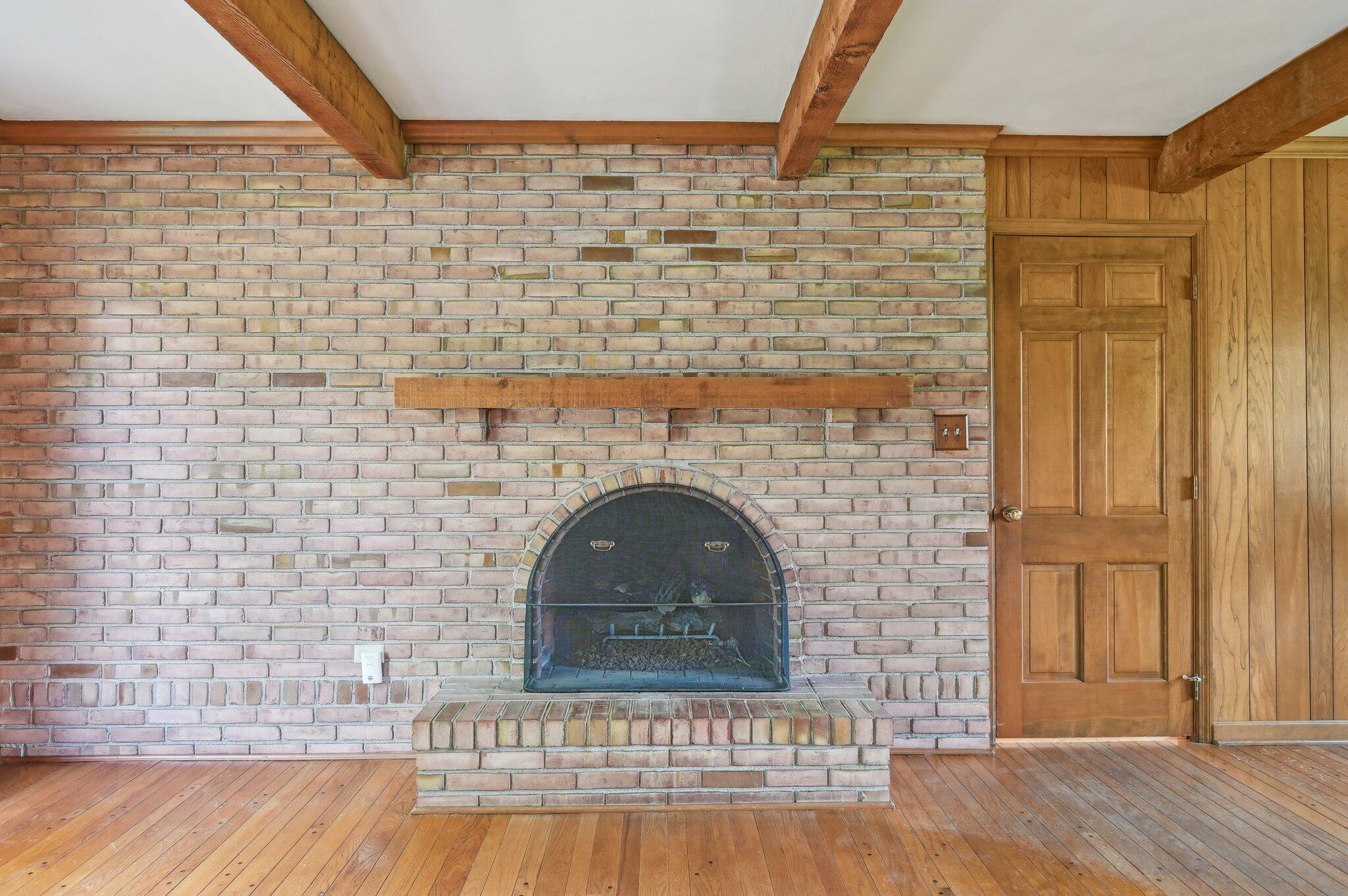 5917 Rocky Rill Road Columbus, OH 43235 - Photo 8 of 47 Fireplace – Close-Up
Wood-burning arched fireplace set in full brick wall, a charming focal point for cozy gatherings.