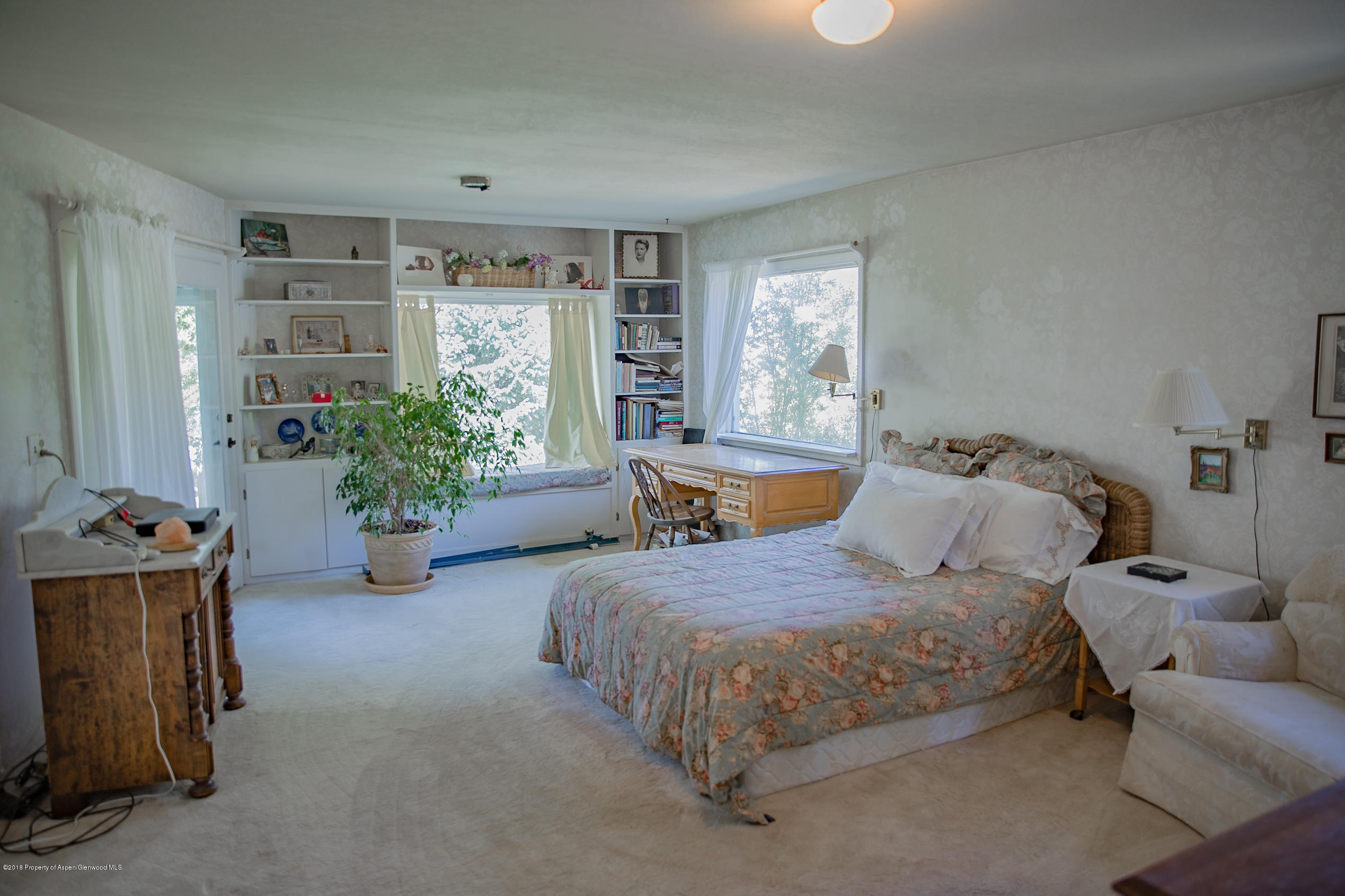 513 North Thomas Road Carbondale, CO 81623 - Photo 15 of 23 a bedroom with bed and a window