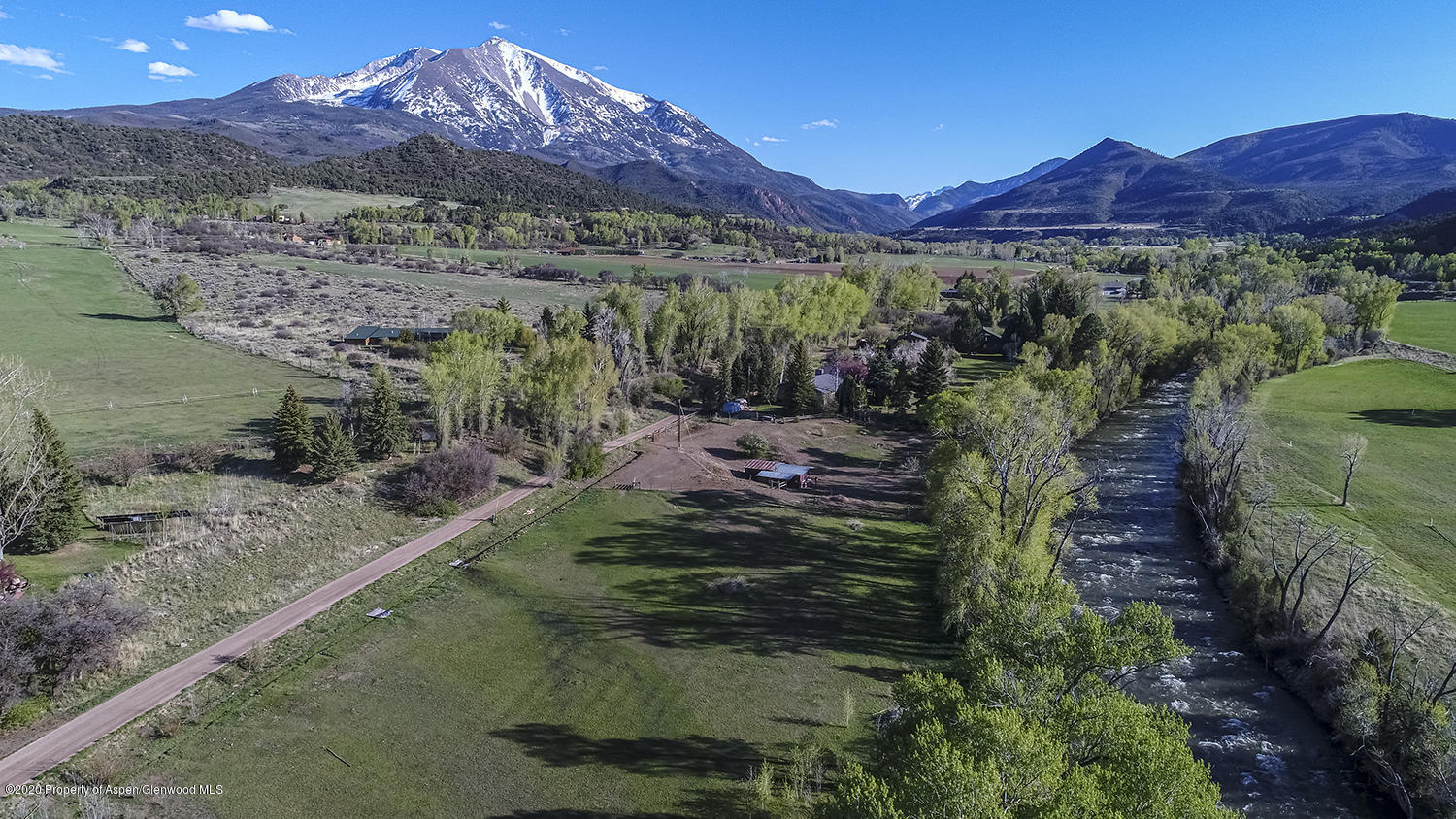 513 North Thomas Road Carbondale, CO 81623 - Photo 3 of 23 a view of a lush green hillside and a houses