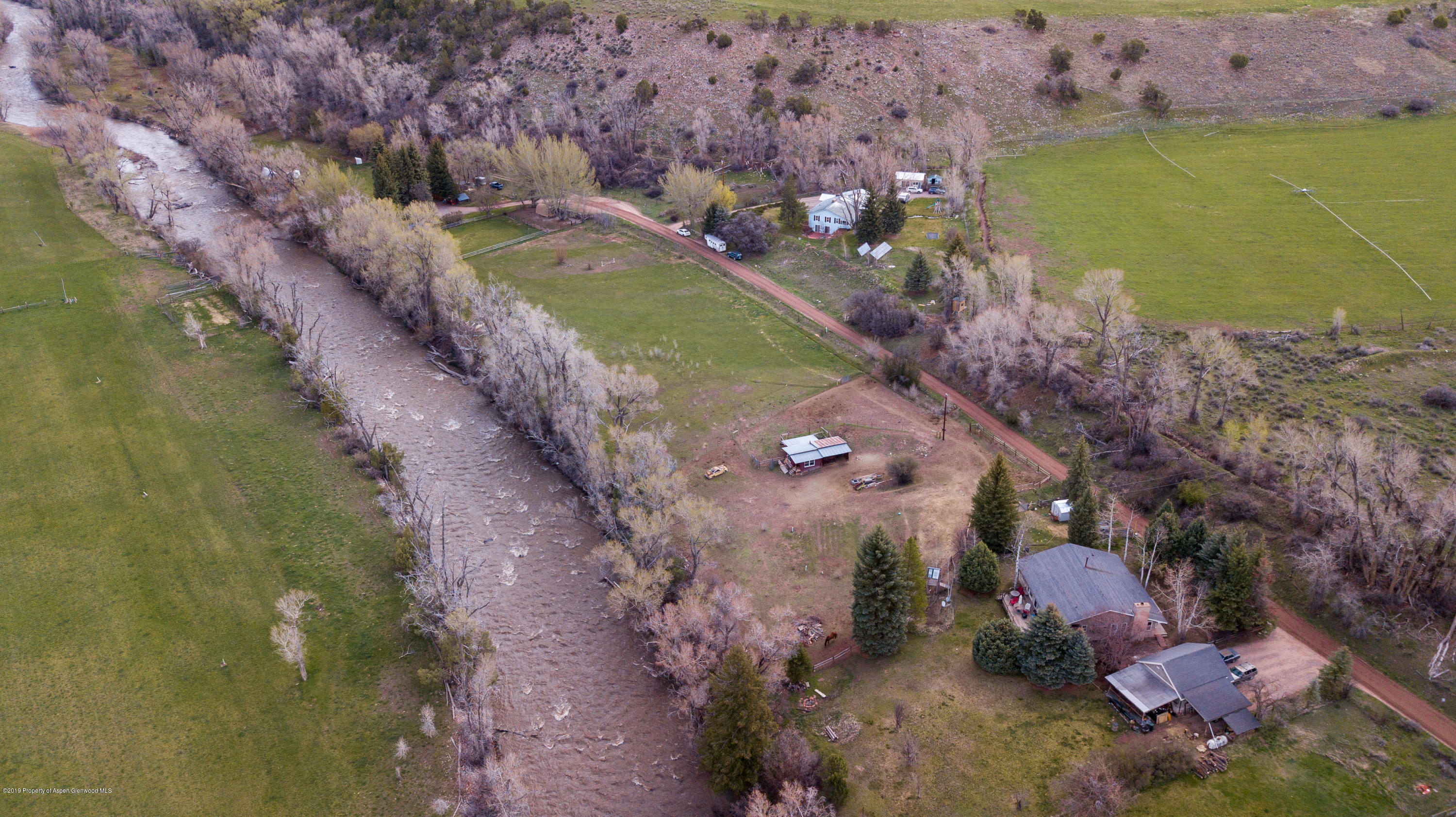 513 North Thomas Road Carbondale, CO 81623 - Photo 5 of 23 a view of a lake with a yard