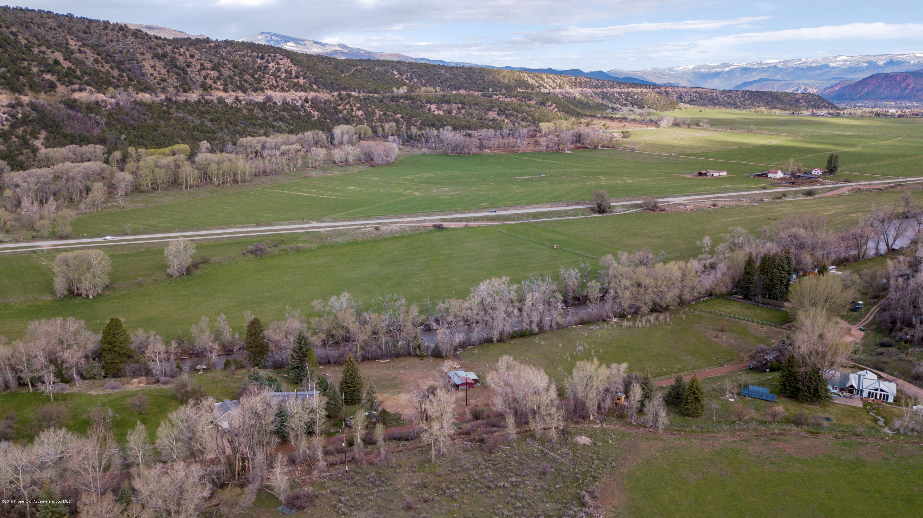 513 North Thomas Road Carbondale, CO 81623 - Photo 10 of 23 a view of a lake with a mountain in the background