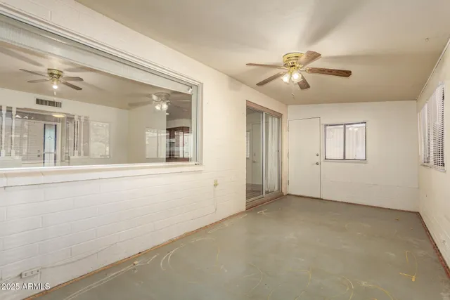 a view of an empty room with a window