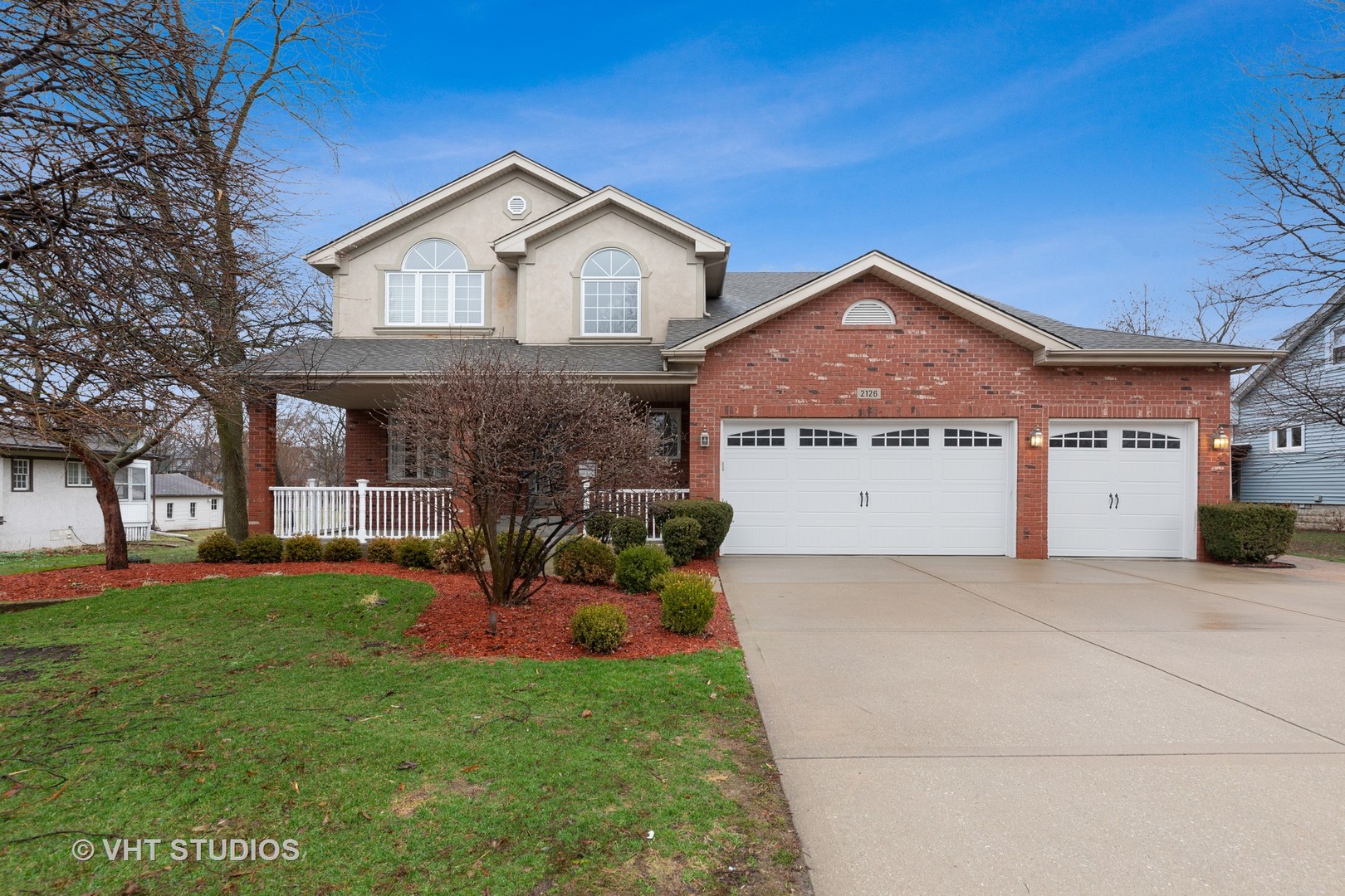 2126 Pine Road Homewood, IL 60430 - Photo 1 of 22 a front view of a house with a yard and garage