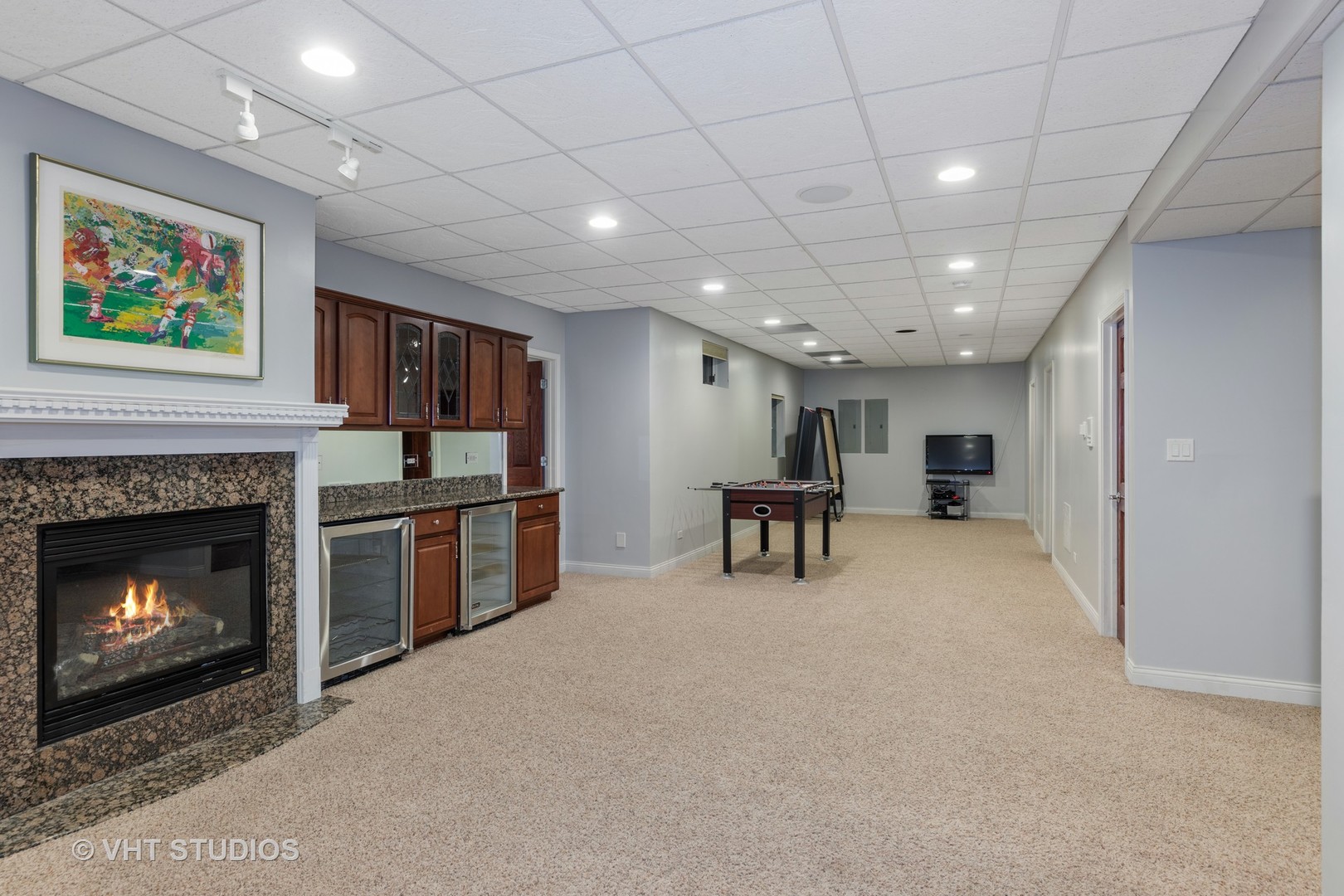 2126 Pine Road Homewood, IL 60430 - Photo 19 of 22 a living room with furniture a fireplace and a flat screen tv
