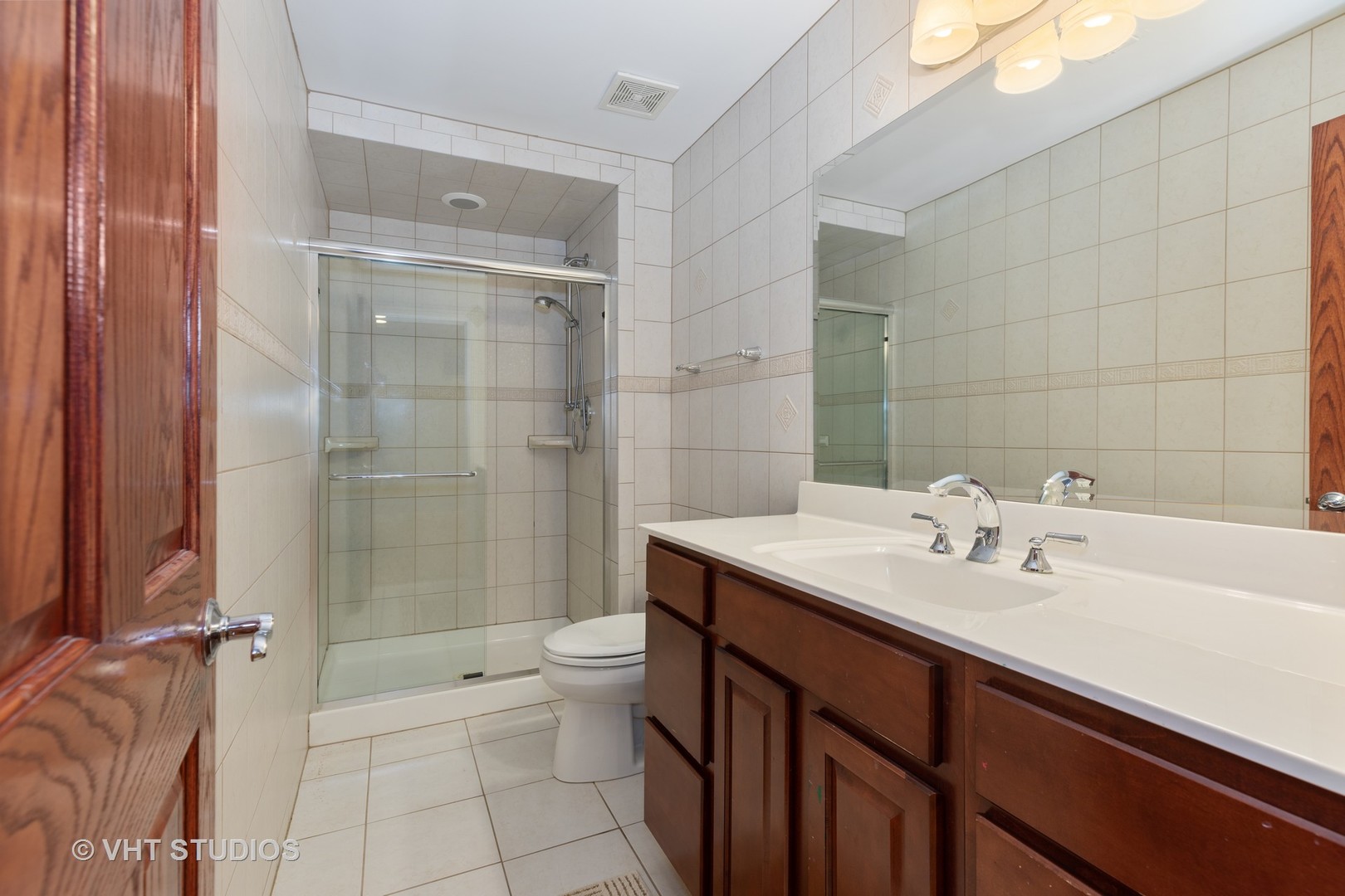 2126 Pine Road Homewood, IL 60430 - Photo 21 of 22 a bathroom with a sink a toilet and shower