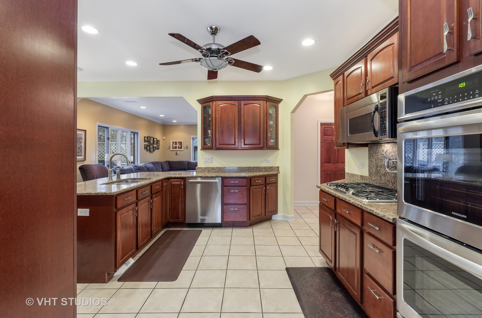 2126 Pine Road Homewood, IL 60430 - Photo 7 of 22 a kitchen with stainless steel appliances granite countertop a stove a sink dishwasher and a stove top oven with wooden cabinets