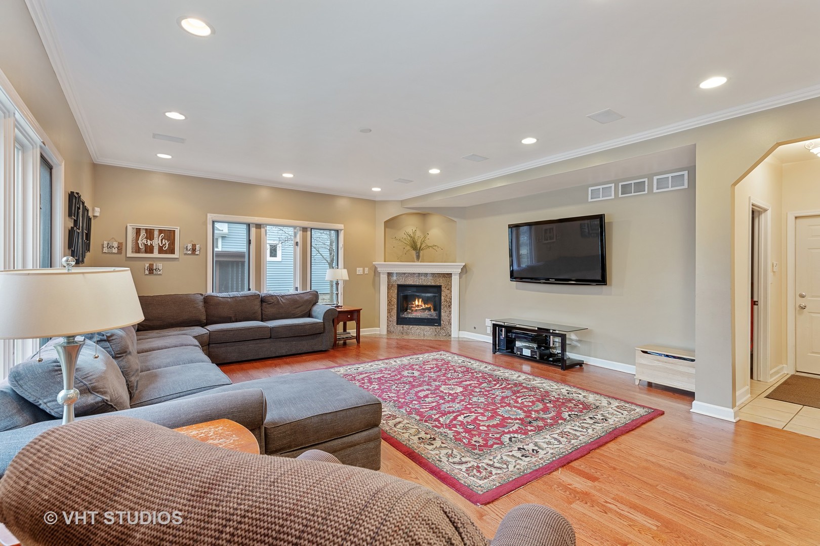 2126 Pine Road Homewood, IL 60430 - Photo 9 of 22 a living room with furniture flat screen tv and a fireplace