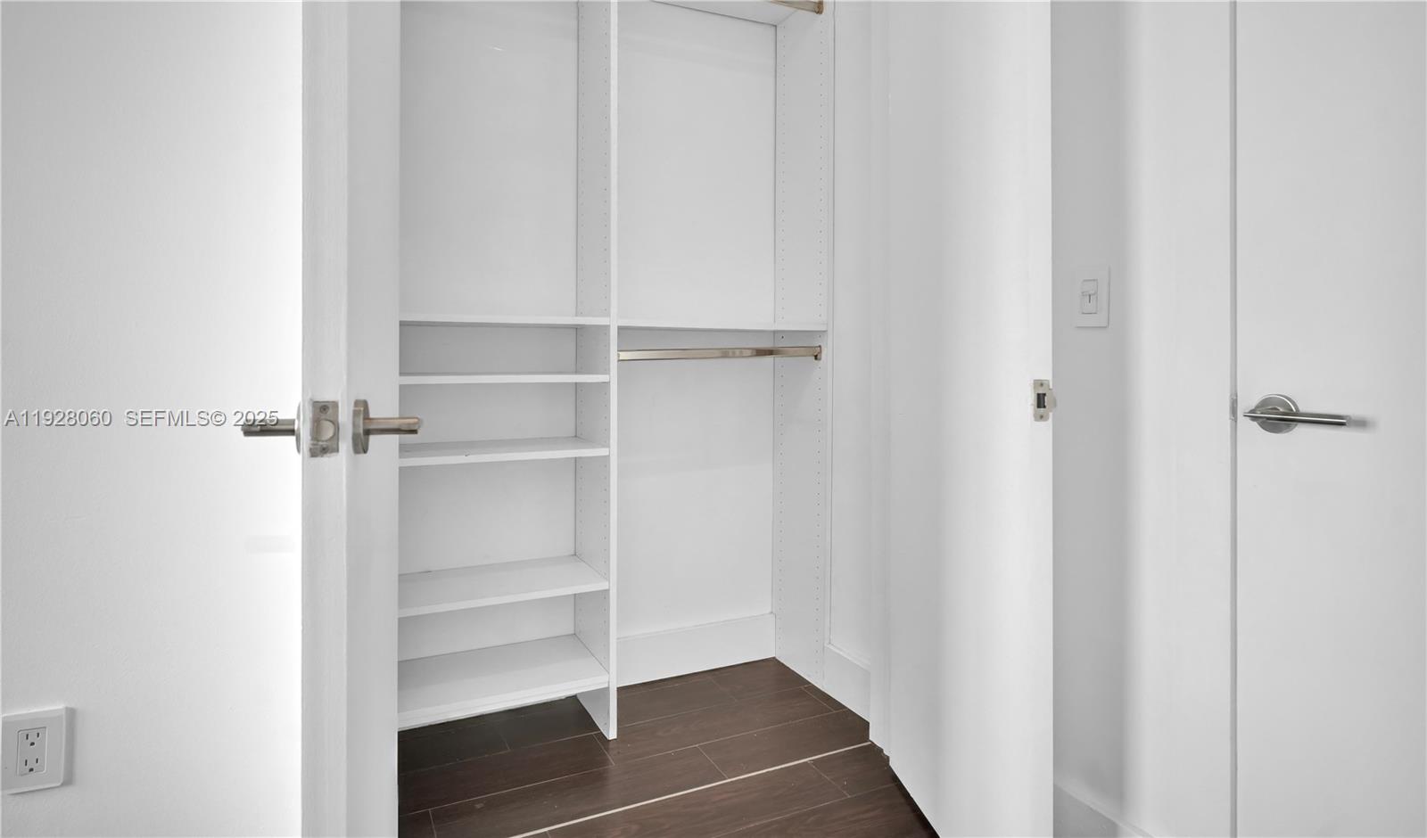 1457 Meridian Avenue, Unit 204 Miami Beach, FL 33139 - Photo 12 of 20 a view of walk in closet with empty racks