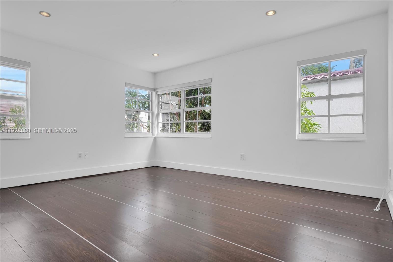 1457 Meridian Avenue, Unit 204 Miami Beach, FL 33139 - Photo 7 of 20 an empty room with windows