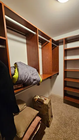 a view of a hallway with a closet