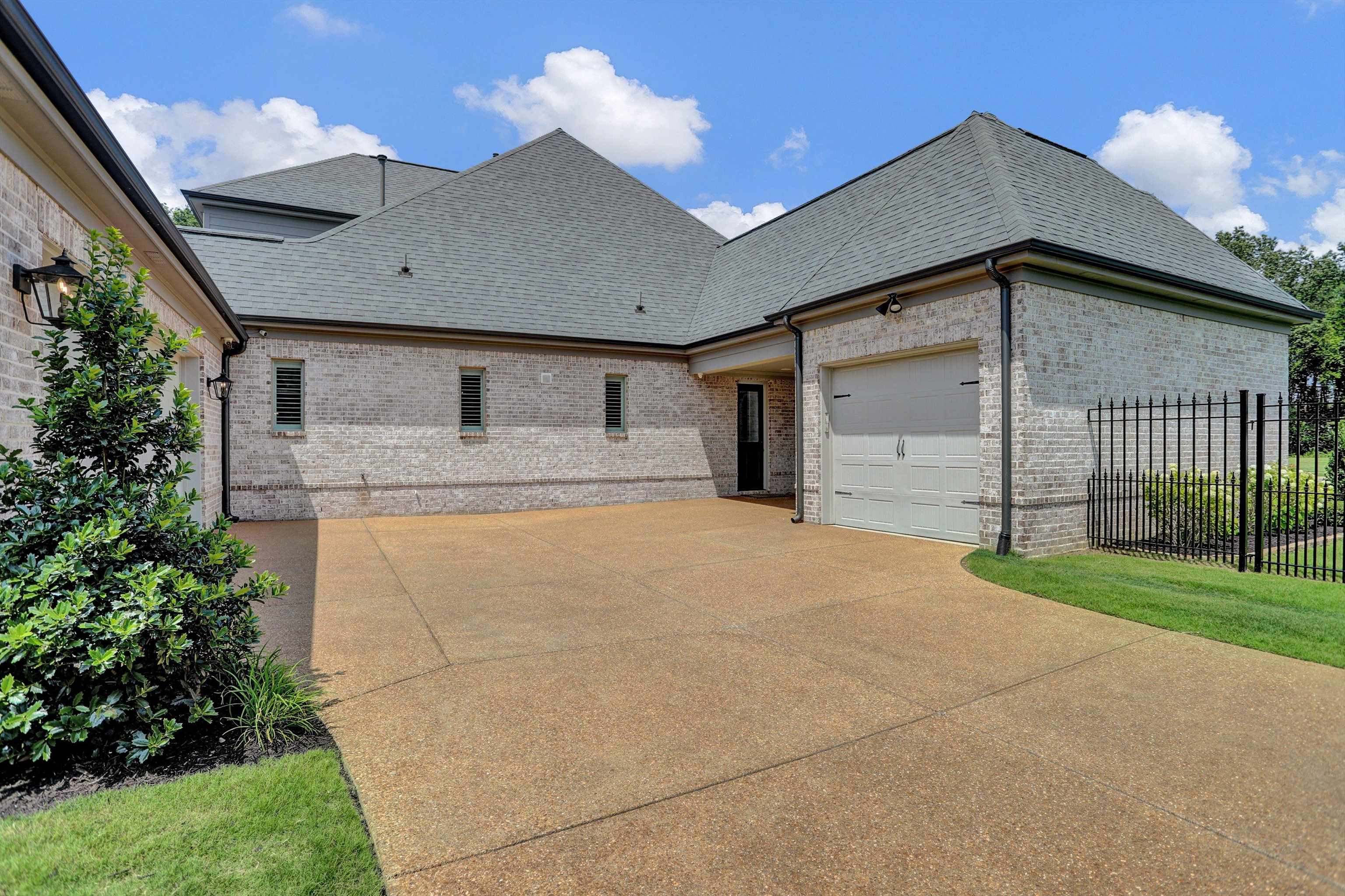 1237 Monroe Hill Circle West Collierville, TN 38017 - Photo 26 of 37 Pull out the kiddie bikes, skates or chalk - or save this for an outdoor party pad! Just know it is enhanced by the exquisite landscape and automatic gate!