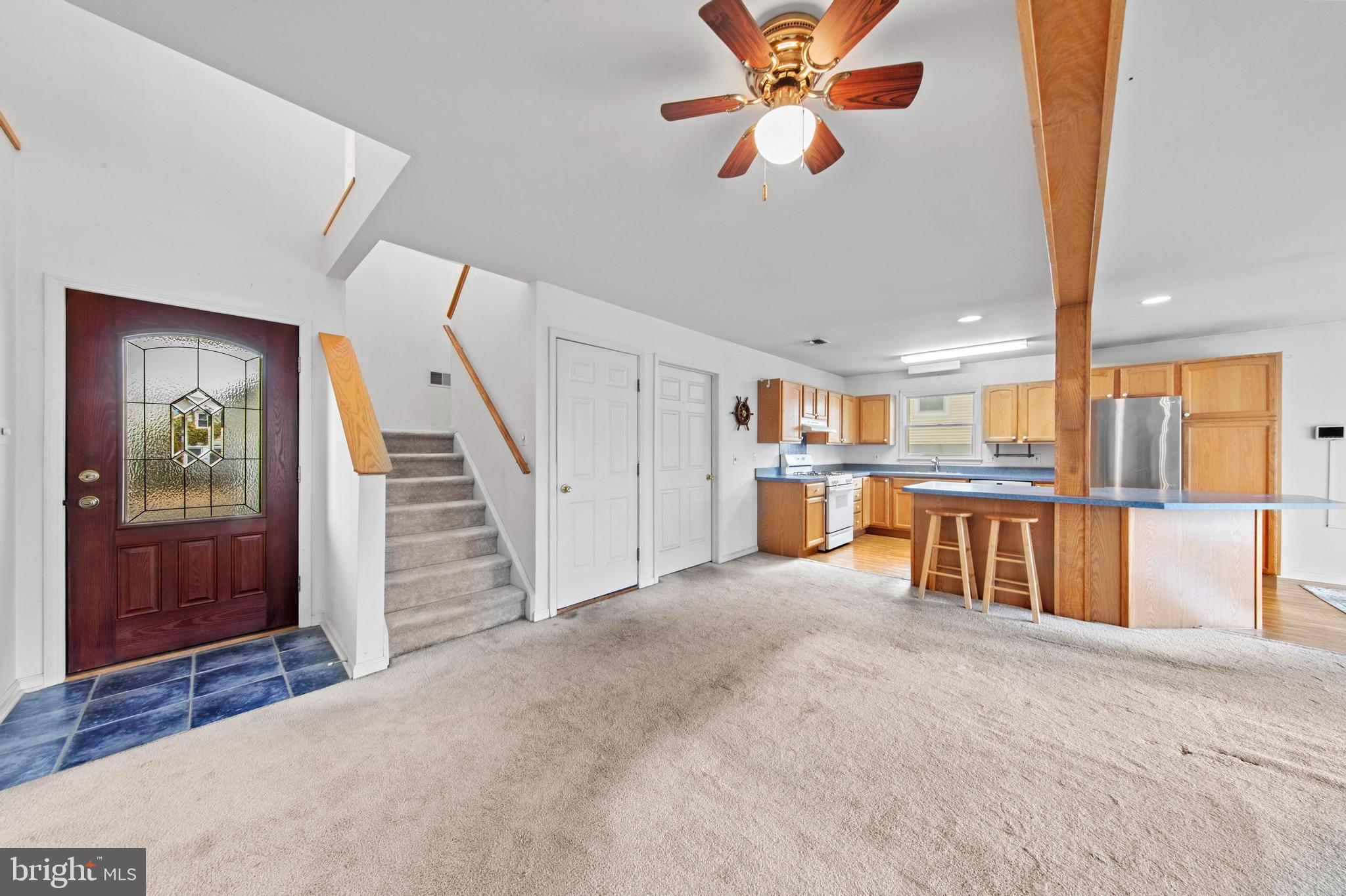 108 West 22nd Street Ship Bottom, NJ 08008 - Photo 34 of 66 a view of a kitchen with furniture and a chandelier