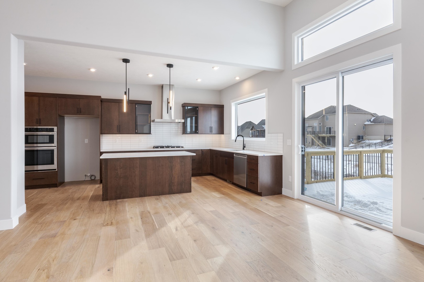 5303 Finlen Lane Bloomington, IL 61705 - Photo 16 of 58 a large white kitchen with a large window